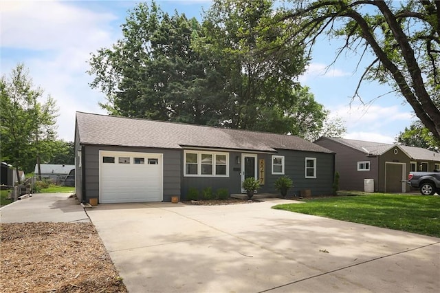 6217 Glenwood St, Mission, KS 66202 - single story home with a garage, concrete driveway, a front yard, and roof with shingles