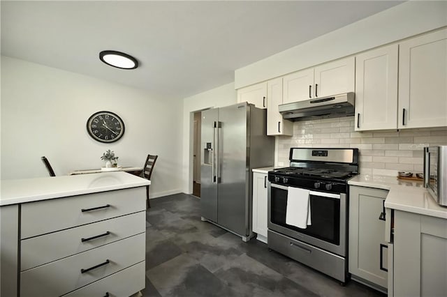6217 Glenwood St, Mission, KS 66202 - kitchen with appliances with stainless steel finishes, under cabinet range hood, tasteful backsplash, light countertops, and gray cabinetry