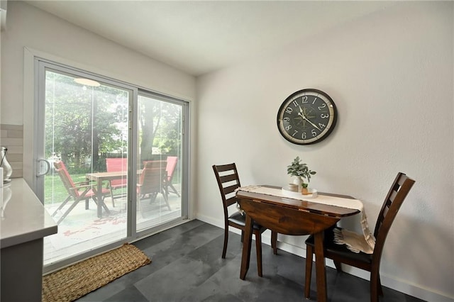 6217 Glenwood St, Mission, KS 66202 - dining room with baseboards and finished concrete floors