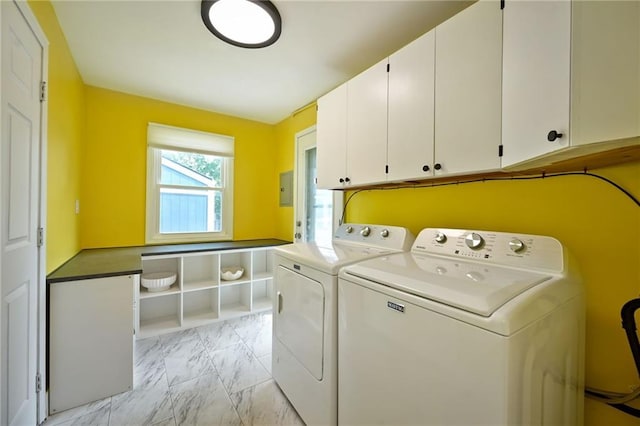 6217 Glenwood St, Mission, KS 66202 - laundry room featuring cabinet space, light marble finish floors, washing machine and dryer, and electric panel