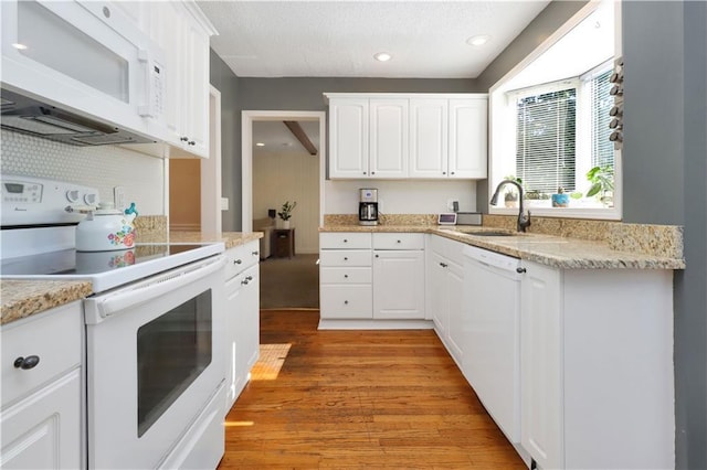 5217 Birch St, Roeland Park, KS 66205 - kitchen featuring white appliances, light wood-type flooring, white cabinetry, and recessed lighting