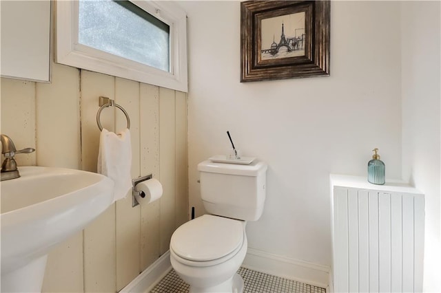 5217 Birch St, Roeland Park, KS 66205 - bathroom featuring radiator and tile patterned floors