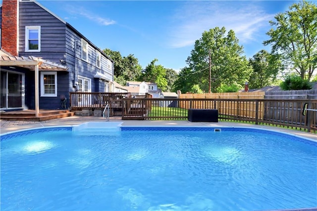 5217 Birch St, Roeland Park, KS 66205 - view of pool featuring a pergola, a deck, and a fenced backyard