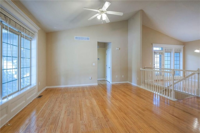 15730 S Brentwood St Unit 2602, Olathe, KS 66062 - unfurnished room with lofted ceiling, wood finished floors, and plenty of natural light