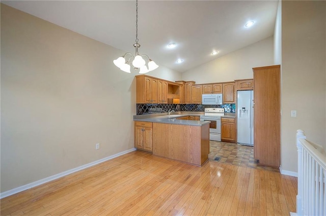 15730 S Brentwood St Unit 2602, Olathe, KS 66062 - kitchen featuring white appliances, open shelves, a chandelier, a peninsula, and decorative backsplash