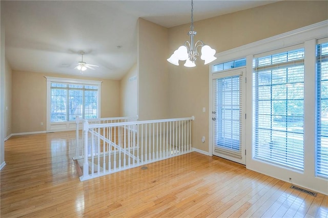 15730 S Brentwood St Unit 2602, Olathe, KS 66062 - empty room featuring hardwood / wood-style floors, a chandelier, ceiling fan, and lofted ceiling