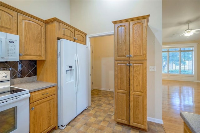 15730 S Brentwood St Unit 2602, Olathe, KS 66062 - kitchen featuring white appliances, decorative backsplash, a ceiling fan, brown cabinets, and light countertops