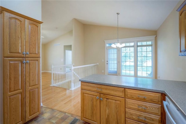 15730 S Brentwood St Unit 2602, Olathe, KS 66062 - kitchen featuring lofted ceiling, white dishwasher, a chandelier, decorative light fixtures, and light countertops
