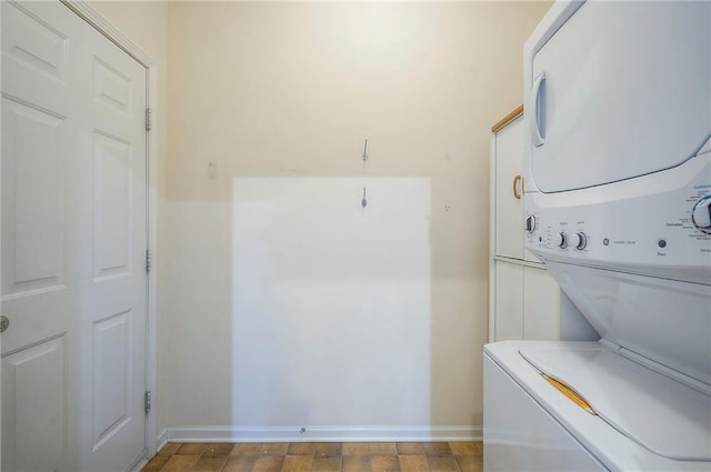 15730 S Brentwood St Unit 2602, Olathe, KS 66062 - laundry area featuring stacked washing machine and dryer and baseboards