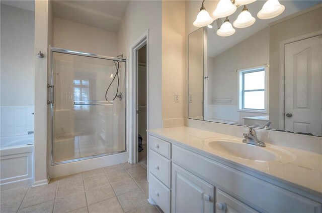 15730 S Brentwood St Unit 2602, Olathe, KS 66062 - full bathroom featuring a shower stall, tile patterned floors, vanity, a garden tub, and a chandelier