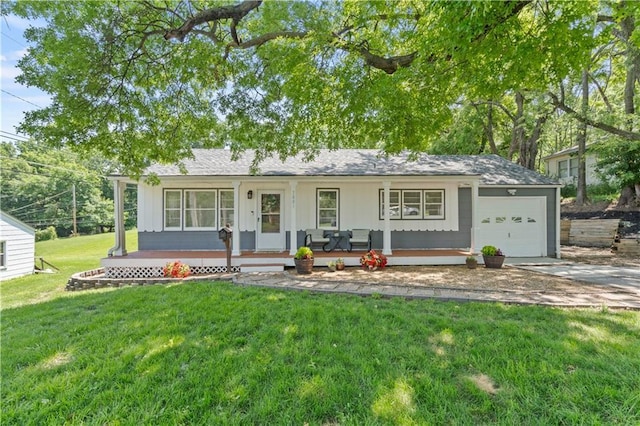 7801 W 55th Ter, Overland Park, KS 66202 - single story home with a porch, a garage, a front yard, concrete driveway, and board and batten siding