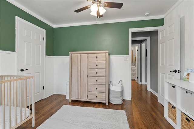 7801 W 55th Ter, Overland Park, KS 66202 - bedroom with a wainscoted wall, dark wood-style flooring, and a ceiling fan