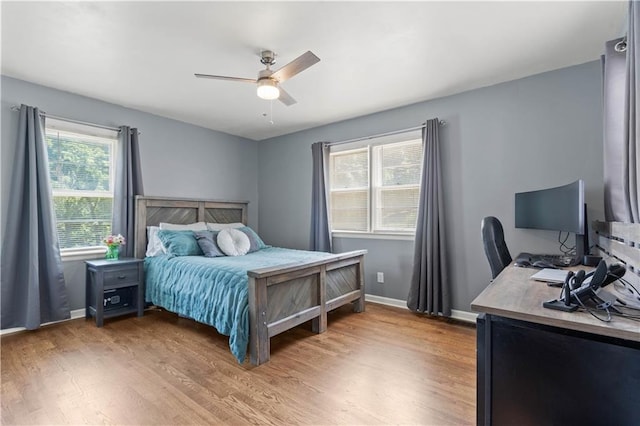 7801 W 55th Ter, Overland Park, KS 66202 - bedroom with light wood-type flooring, an office area, and a ceiling fan