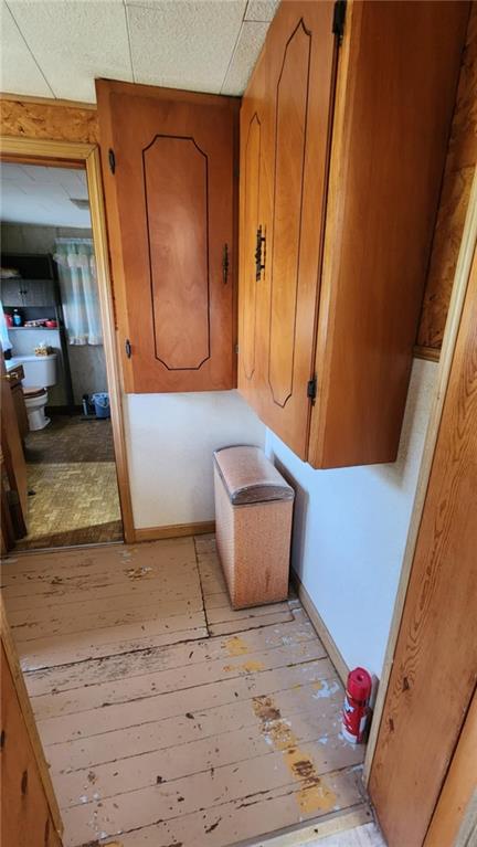 304 N Mckinley St, Weir, KS 66781 - corridor featuring light wood-style floors