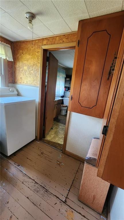 304 N Mckinley St, Weir, KS 66781 - washroom with washer / clothes dryer and light wood finished floors