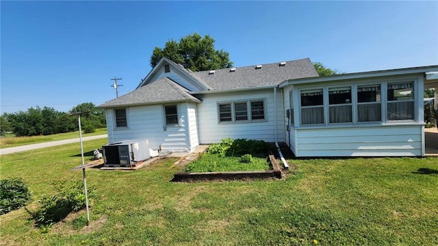 304 N Mckinley St, Weir, KS 66781 - back of house featuring a lawn and a shingled roof