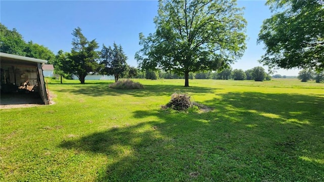 304 N Mckinley St, Weir, KS 66781 - view of green lawn with a carport