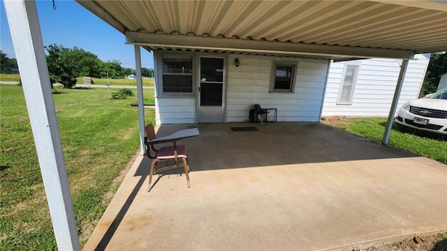 304 N Mckinley St, Weir, KS 66781 - view of patio / terrace featuring a carport