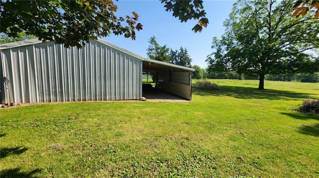 304 N Mckinley St, Weir, KS 66781 - view of grassy yard with a pole building and an outbuilding
