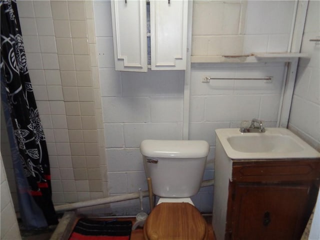 11401 E Scarritt Ave, Sugar Creek, MO 64054 - bathroom with concrete block wall and a shower with curtain