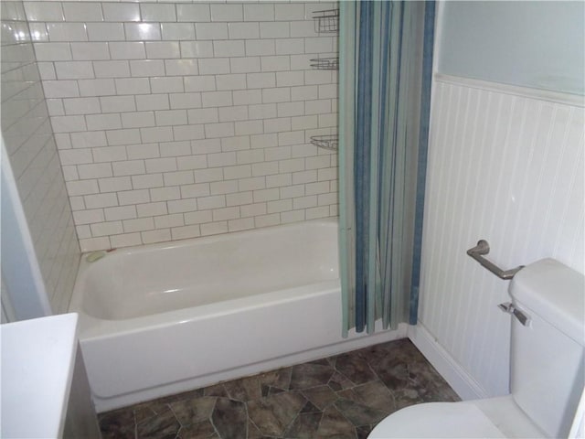 11401 E Scarritt Ave, Sugar Creek, MO 64054 - bathroom with toilet and shower / bath combo with shower curtain