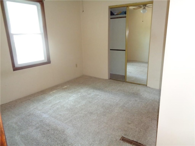 11401 E Scarritt Ave, Sugar Creek, MO 64054 - unfurnished bedroom featuring carpet floors and a closet