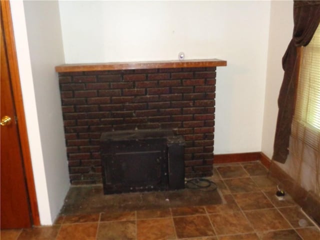 11401 E Scarritt Ave, Sugar Creek, MO 64054 - detailed view of a fireplace and baseboards