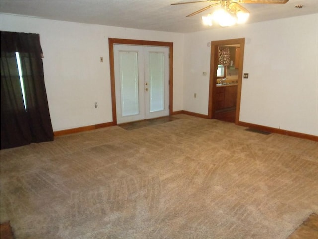 11401 E Scarritt Ave, Sugar Creek, MO 64054 - empty room featuring a ceiling fan, french doors, and light carpet