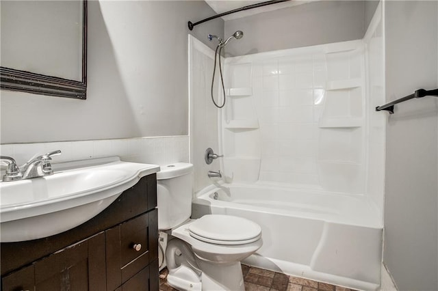 508 NE Shiloh Cir, Blue Springs, MO 64014 - full bathroom featuring vanity, washtub / shower combination, tile walls, and wainscoting