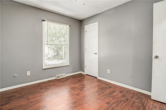 508 NE Shiloh Cir, Blue Springs, MO 64014 - spare room with healthy amount of natural light and wood finished floors