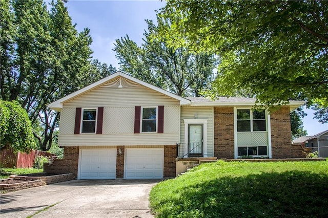 508 NE Shiloh Cir, Blue Springs, MO 64014 - raised ranch featuring driveway, brick siding, and an attached garage