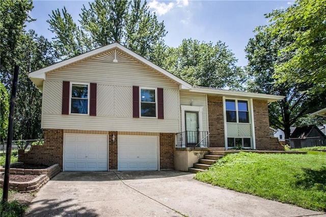508 NE Shiloh Cir, Blue Springs, MO 64014 - raised ranch with brick siding, concrete driveway, an attached garage, and a front yard