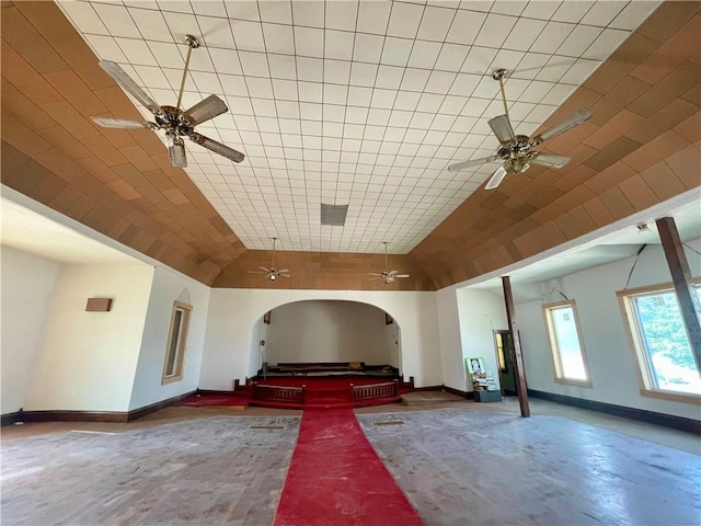 130 W 2nd St, Clearmont, MO 64431 - unfurnished living room with a ceiling fan, lofted ceiling, and arched walkways