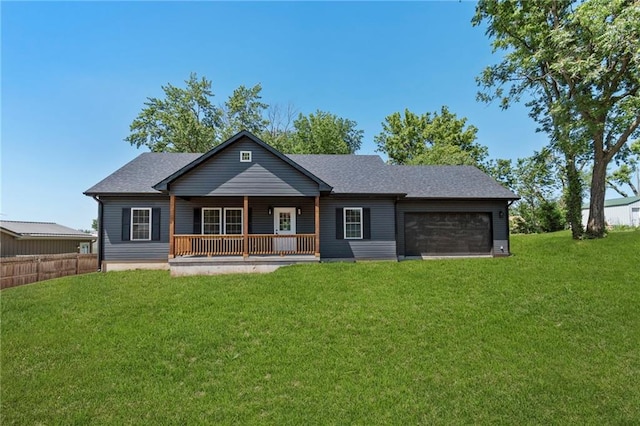 410 E Main St, Richmond, MO 64085 - view of front of house featuring an attached garage, covered porch, and a shingled roof