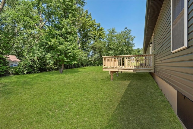 410 E Main St, Richmond, MO 64085 - view of green lawn with a wooden deck