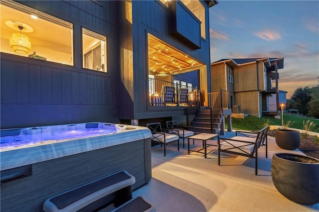 11594 S Zarda Dr, Olathe, KS 66061 - patio terrace at dusk with a hot tub and a patio area