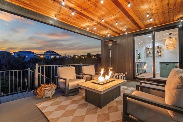 11594 S Zarda Dr, Olathe, KS 66061 - patio terrace at dusk featuring an outdoor living space with a fire pit