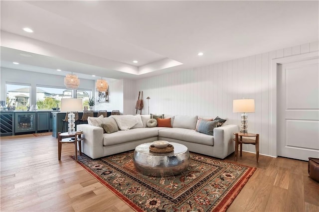 11594 S Zarda Dr, Olathe, KS 66061 - living room featuring light wood finished floors, recessed lighting, and beverage cooler