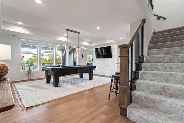 11594 S Zarda Dr, Olathe, KS 66061 - recreation room featuring pool table, light wood finished floors, recessed lighting, and a tray ceiling