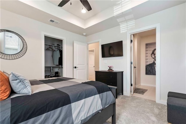 11594 S Zarda Dr, Olathe, KS 66061 - bedroom featuring light colored carpet, a raised ceiling, a closet, a ceiling fan, and a spacious closet
