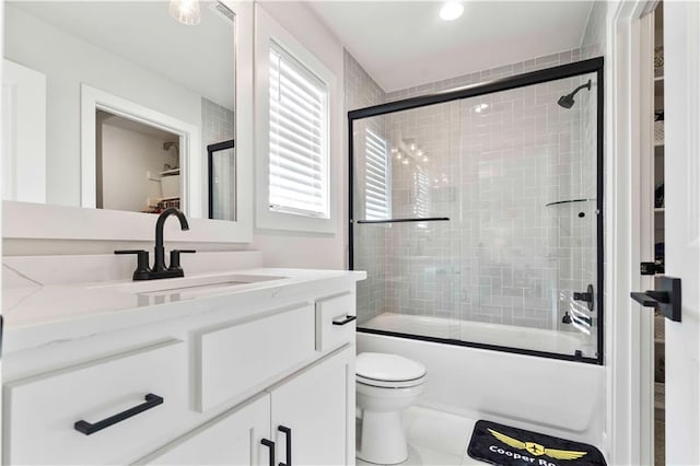 11594 S Zarda Dr, Olathe, KS 66061 - bathroom with vanity and bath / shower combo with glass door