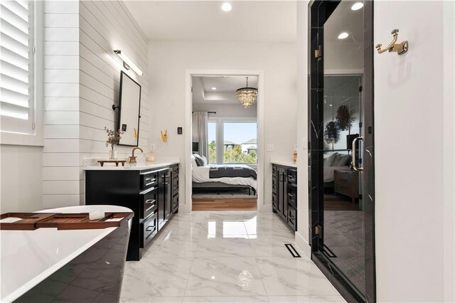 11594 S Zarda Dr, Olathe, KS 66061 - bathroom featuring vanity, a freestanding bath, recessed lighting, marble finish flooring, and ensuite bath