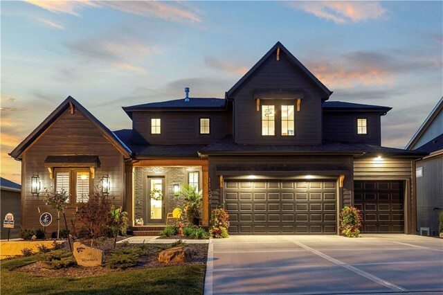 11594 S Zarda Dr, Olathe, KS 66061 - view of front facade with a garage and concrete driveway