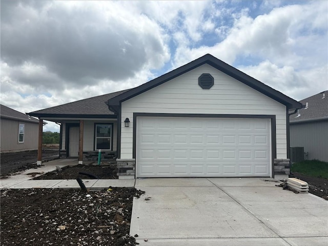 20277 W 194th Ter, St, Spring Hill, KS 66083 - ranch-style home featuring concrete driveway, stone siding, a garage, and covered porch