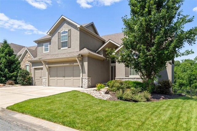 13428 W 172nd St, Overland Park, KS 66221 - view of front of property with stone siding, stucco siding, an attached garage, and driveway