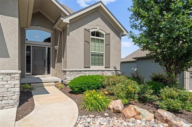 13428 W 172nd St, Overland Park, KS 66221 - doorway to property featuring stone siding and stucco siding