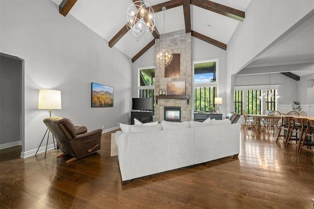 13428 W 172nd St, Overland Park, KS 66221 - living room with beamed ceiling, high vaulted ceiling, a chandelier, dark wood-type flooring, and a stone fireplace