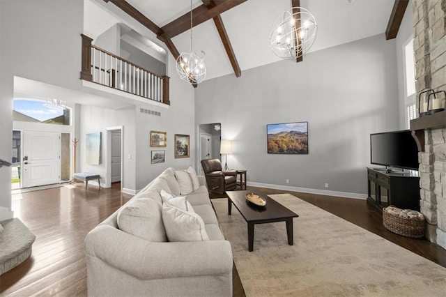 13428 W 172nd St, Overland Park, KS 66221 - living room with a chandelier, high vaulted ceiling, wood finished floors, and beam ceiling