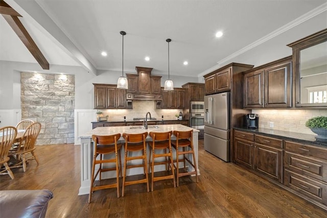 13428 W 172nd St, Overland Park, KS 66221 - kitchen with stainless steel appliances, decorative backsplash, dark brown cabinets, a kitchen bar, and recessed lighting