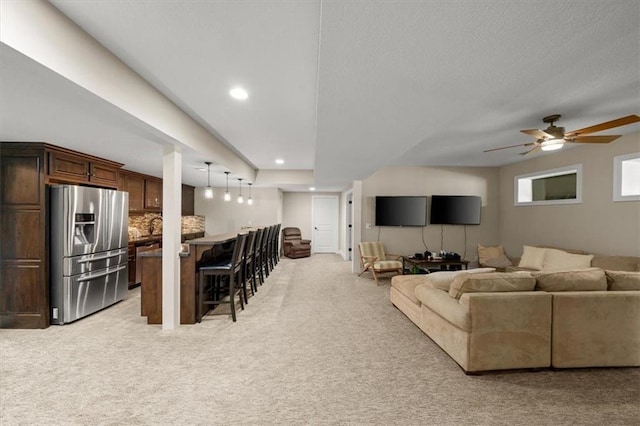 13428 W 172nd St, Overland Park, KS 66221 - living area featuring light colored carpet, a ceiling fan, and recessed lighting